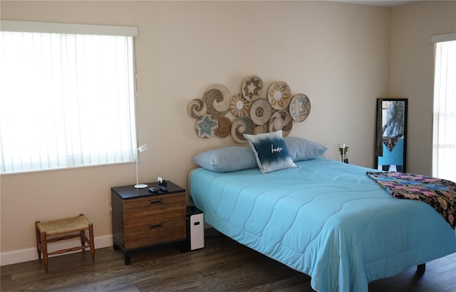 bedroom featuring dark hardwood / wood-style flooring