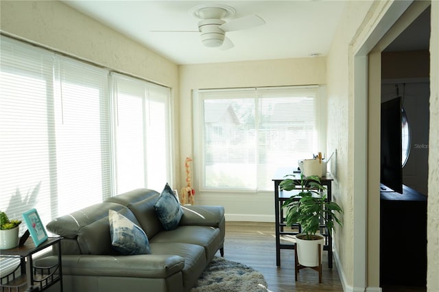 sunroom / solarium featuring ceiling fan