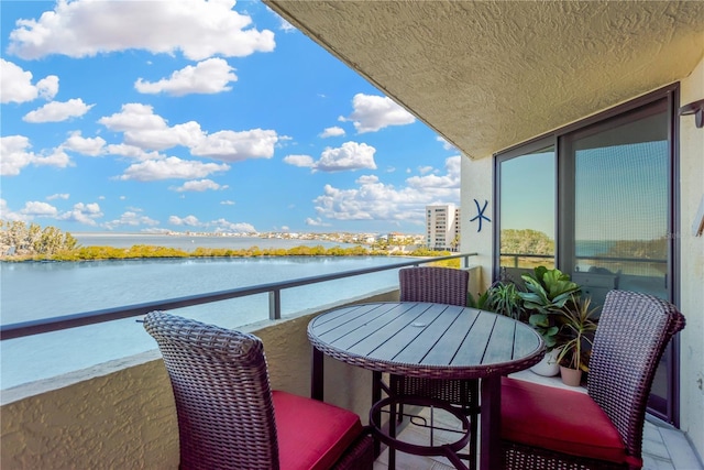 balcony featuring a water view