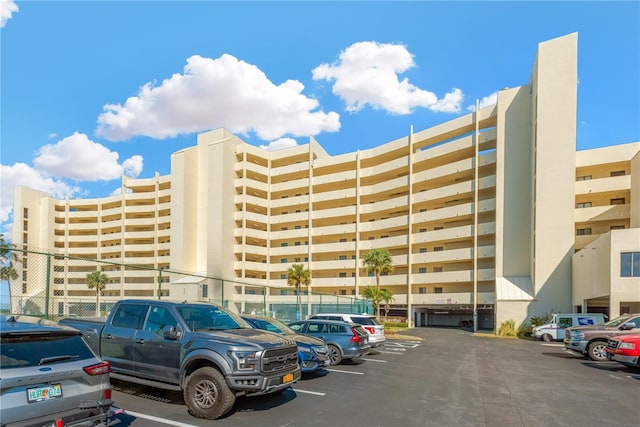 view of building exterior featuring uncovered parking