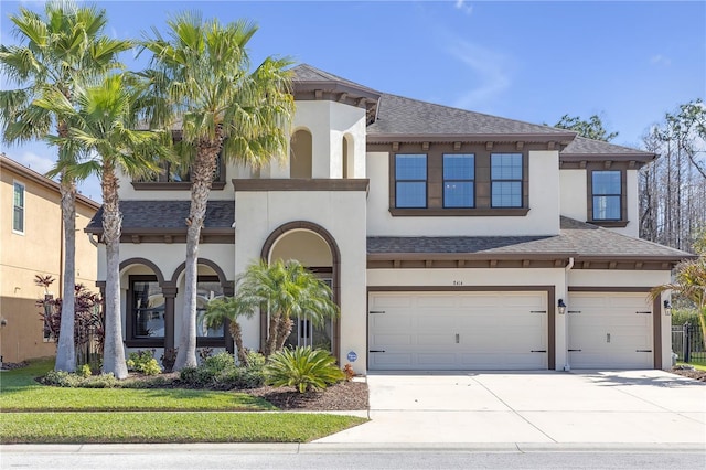 8414 Eagle Brook Dr, Land O Lakes, FL 34638 - view of front facade with a garage, a shingled roof, and stucco siding