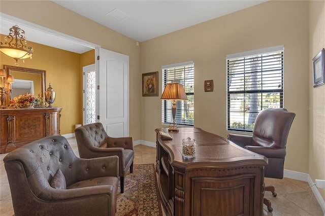 home office with baseboards and light tile patterned floors