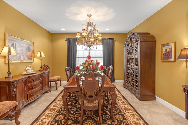 dining space with recessed lighting, baseboards, and an inviting chandelier