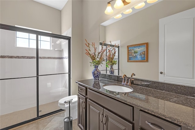 full bathroom with toilet, a shower stall, tile patterned flooring, and vanity