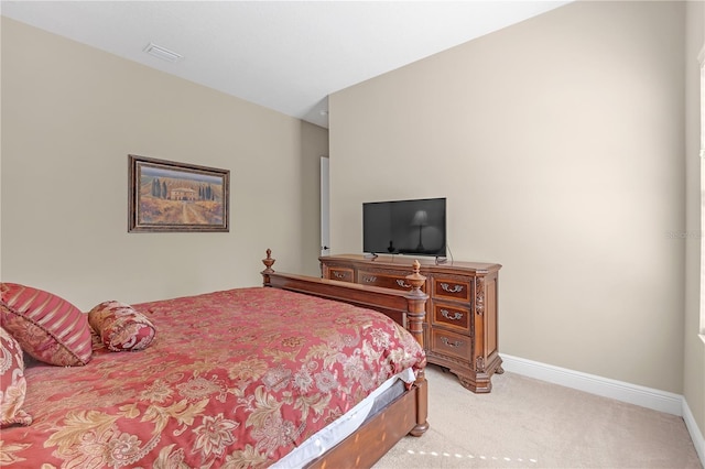 bedroom featuring light carpet, visible vents, and baseboards