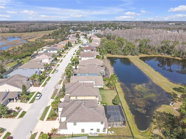 bird's eye view with a water view and a residential view