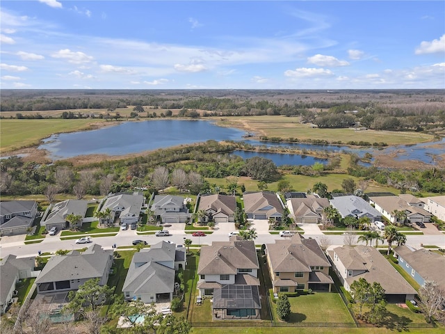 bird's eye view featuring a water view and a residential view