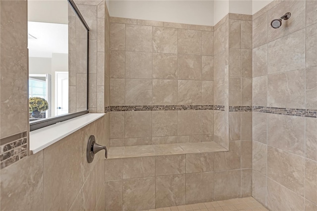 full bathroom with a tile shower