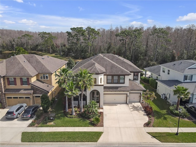 birds eye view of property with a residential view and a view of trees