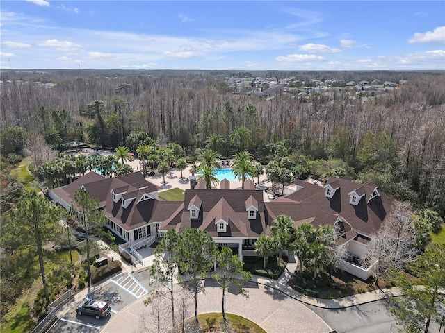 drone / aerial view with a view of trees