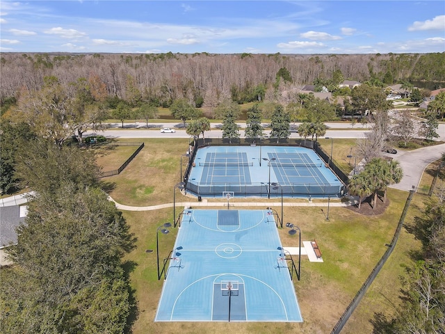 birds eye view of property with a wooded view