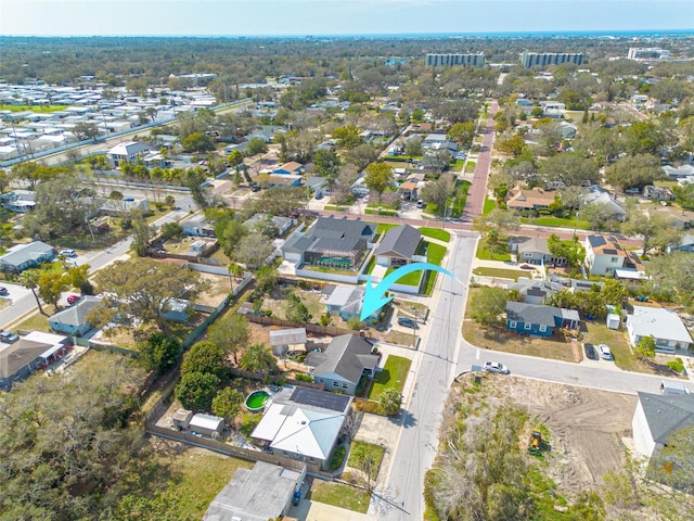 birds eye view of property with a residential view