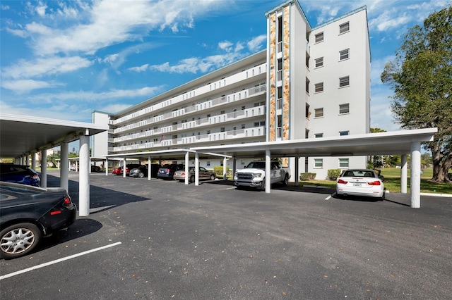 view of building exterior featuring covered parking