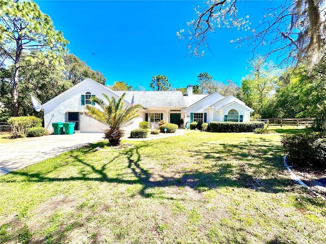 4797 N Lena Dr, Beverly Hills, FL 34465 - view of front of home featuring fence, a front lawn, stucco siding, driveway, and a garage
