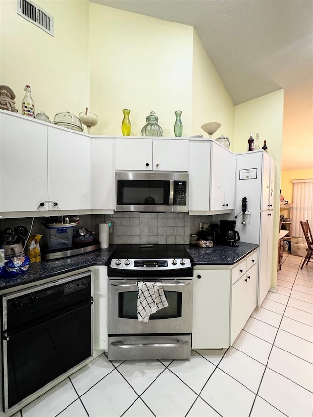 4797 N Lena Dr, Beverly Hills, FL 34465 - kitchen featuring dark countertops, appliances with stainless steel finishes, white cabinetry, and visible vents