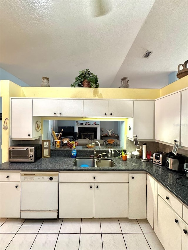 4797 N Lena Dr, Beverly Hills, FL 34465 - kitchen with a toaster, a sink, a textured ceiling, visible vents, and white dishwasher