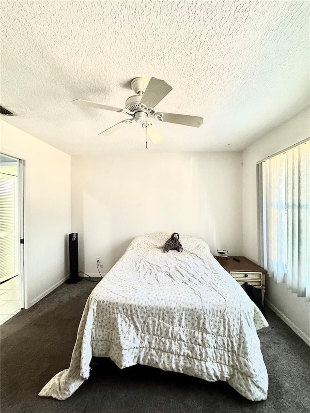 4797 N Lena Dr, Beverly Hills, FL 34465 - bedroom featuring dark colored carpet, baseboards, a ceiling fan, and multiple windows