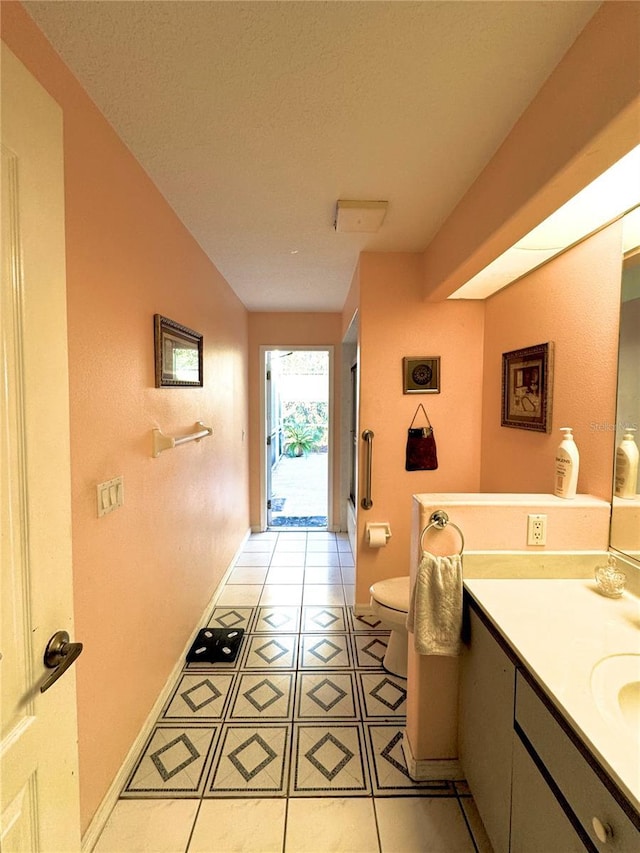 4797 N Lena Dr, Beverly Hills, FL 34465 - bathroom with vanity, tile patterned flooring, baseboards, and toilet
