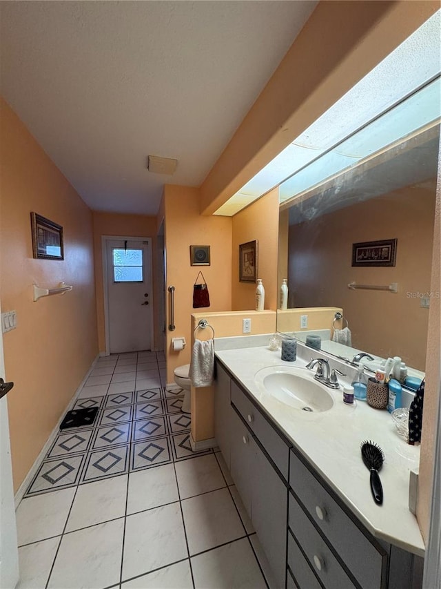 4797 N Lena Dr, Beverly Hills, FL 34465 - bathroom with tile patterned flooring, toilet, and vanity