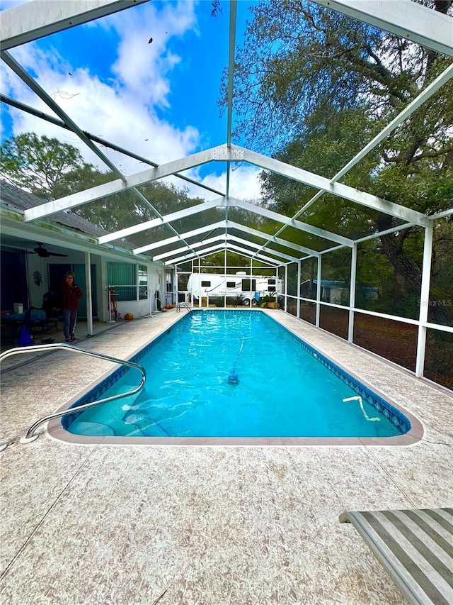 4797 N Lena Dr, Beverly Hills, FL 34465 - pool with glass enclosure, a ceiling fan, and a patio