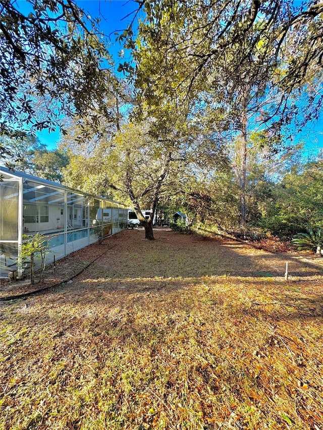 4797 N Lena Dr, Beverly Hills, FL 34465 - view of yard featuring a pool and glass enclosure