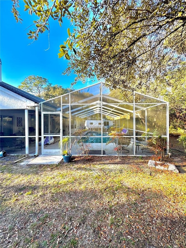 4797 N Lena Dr, Beverly Hills, FL 34465 - exterior space featuring an outdoor pool, a patio area, and glass enclosure