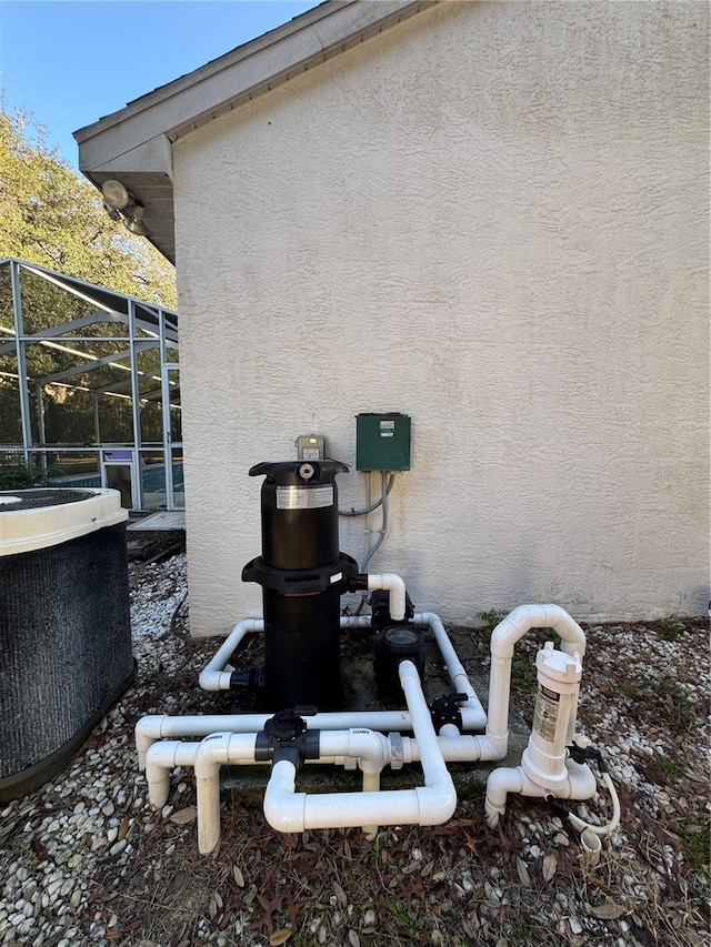 4797 N Lena Dr, Beverly Hills, FL 34465 - details with central AC, pump, and stucco siding