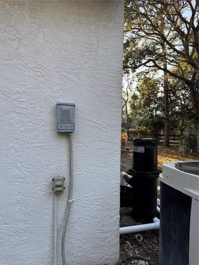 4797 N Lena Dr, Beverly Hills, FL 34465 - view of side of property featuring cooling unit and stucco siding
