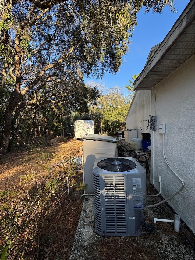 4797 N Lena Dr, Beverly Hills, FL 34465 - details with central air condition unit and stucco siding