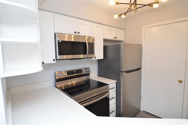 kitchen with appliances with stainless steel finishes and white cabinets