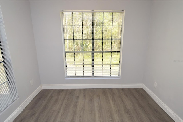 spare room featuring dark hardwood / wood-style flooring