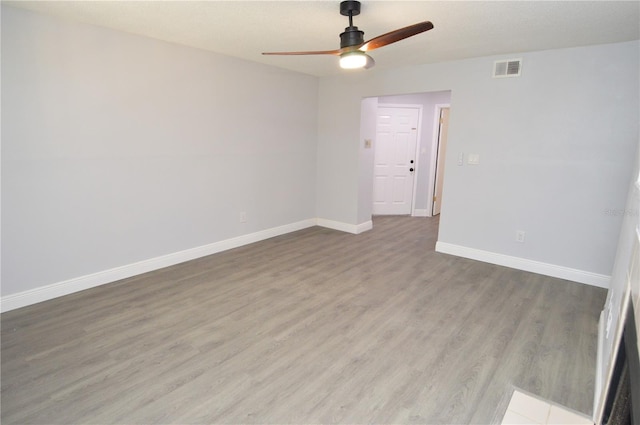 unfurnished room featuring light wood-type flooring and ceiling fan