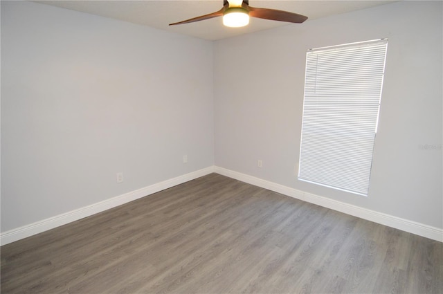 spare room featuring hardwood / wood-style flooring and ceiling fan