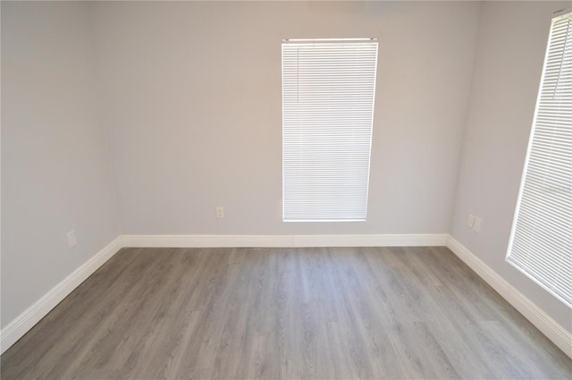 unfurnished room with light hardwood / wood-style flooring