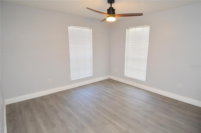 spare room featuring hardwood / wood-style flooring and ceiling fan