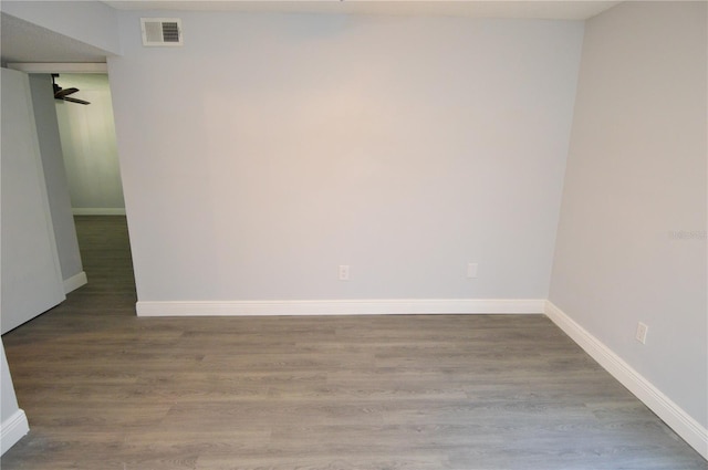 empty room featuring wood-type flooring