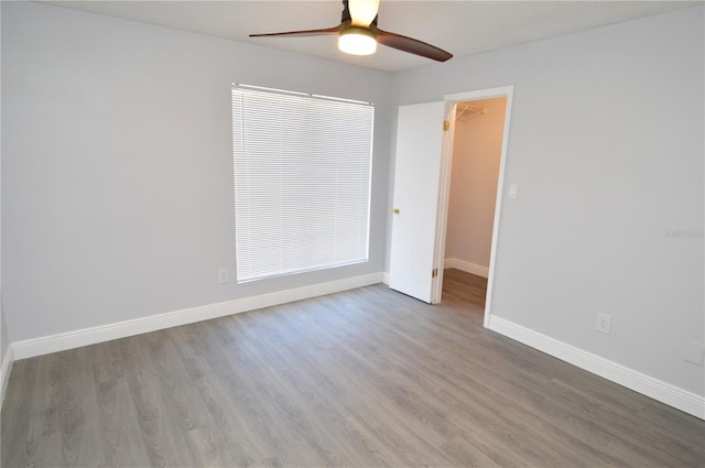 spare room featuring ceiling fan and light hardwood / wood-style floors