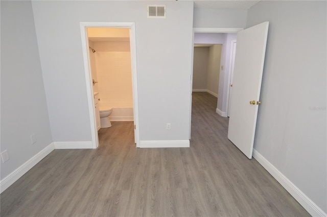 unfurnished bedroom featuring light hardwood / wood-style floors