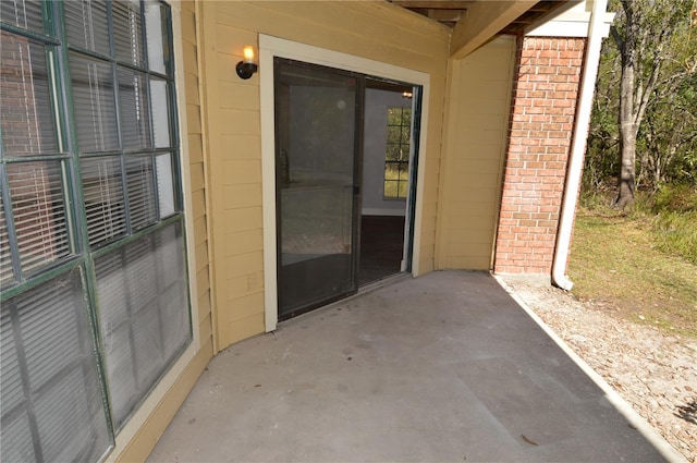 property entrance with a patio