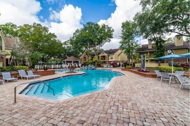 view of swimming pool featuring a patio area