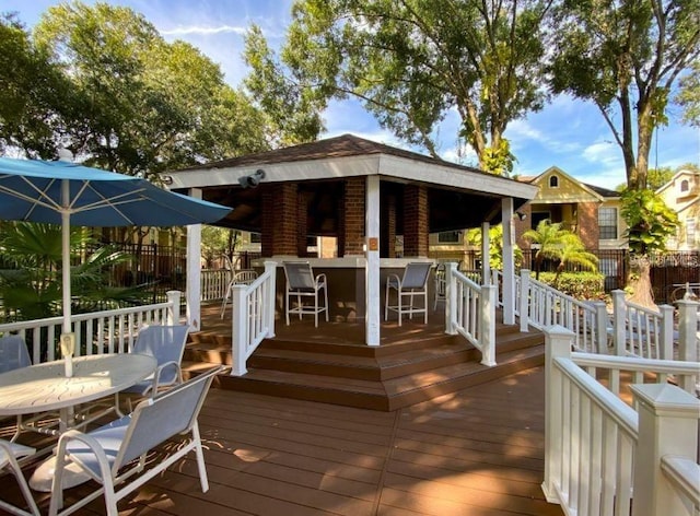 wooden deck featuring an outdoor bar