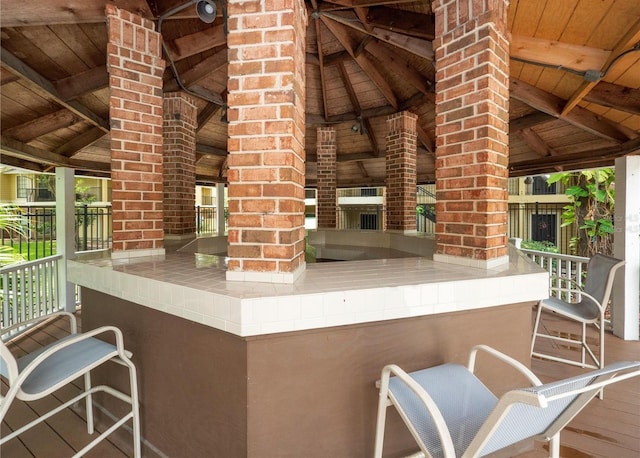 view of patio / terrace featuring a gazebo and a bar