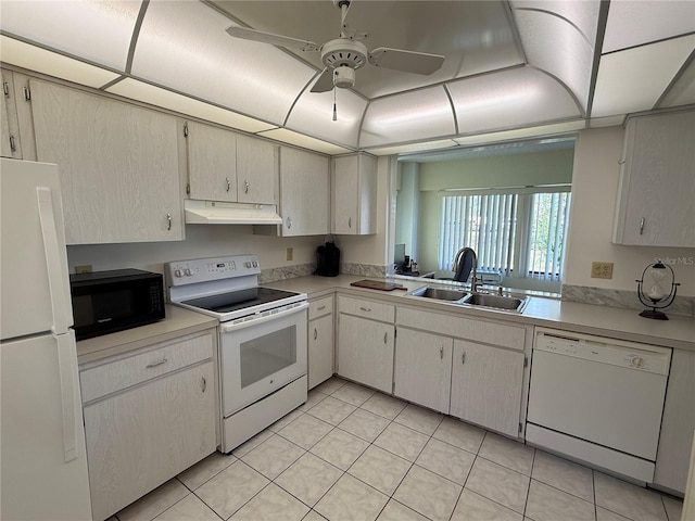 kitchen with white appliances, ceiling fan, light tile patterned floors, and sink