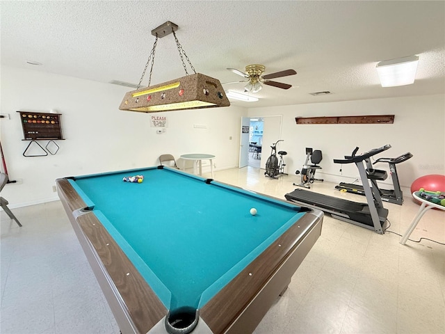 recreation room featuring ceiling fan, billiards, and a textured ceiling