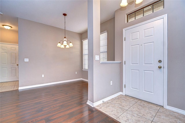 foyer featuring a notable chandelier and hardwood / wood-style floors