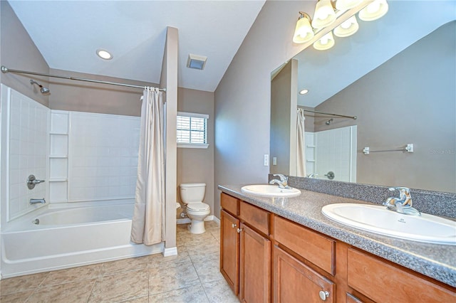 full bathroom with tile patterned floors, vanity, toilet, and shower / tub combo