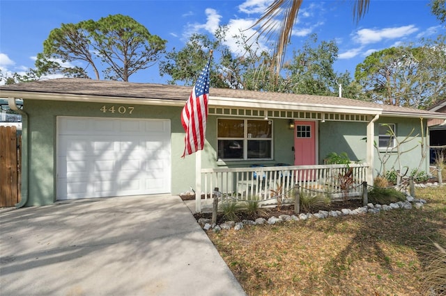 ranch-style house featuring a porch, concrete driveway, a garage, and stucco siding