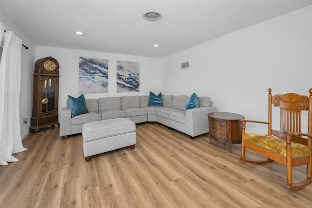 living room with light hardwood / wood-style floors