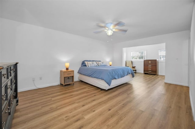 bedroom with light wood-type flooring and ceiling fan