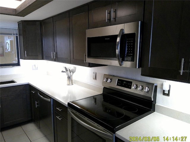 kitchen featuring appliances with stainless steel finishes, light countertops, and light tile patterned floors